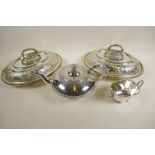 A pair of good quality silver plated oval serving tureens with chased and engraved decoration to