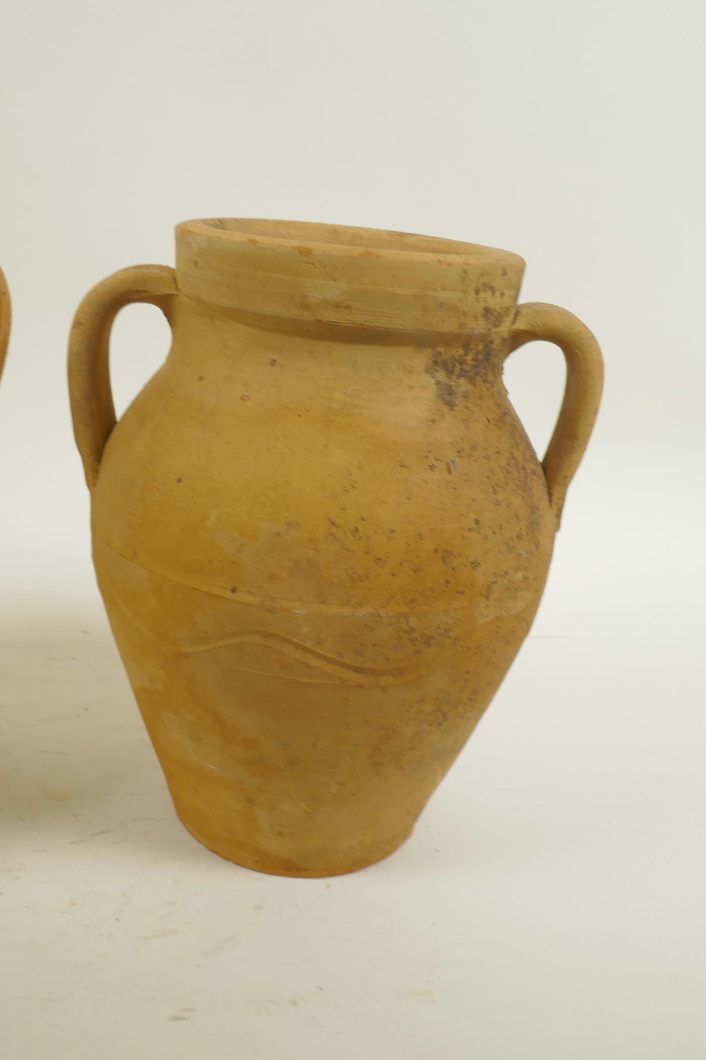 A pair of continental terracotta two handled jars, 8" high - Image 4 of 4