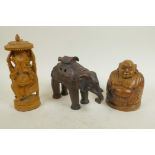 An Asian pottery incensor in the form of an elephant, 4½" high, together with carved sandalwood
