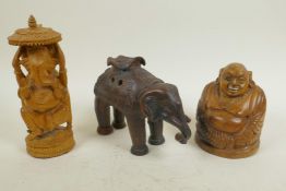 An Asian pottery incensor in the form of an elephant, 4½" high, together with carved sandalwood