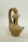 A Chinese celadon glazed pottery censer/vessel in the form of a goose and carp, 7" high