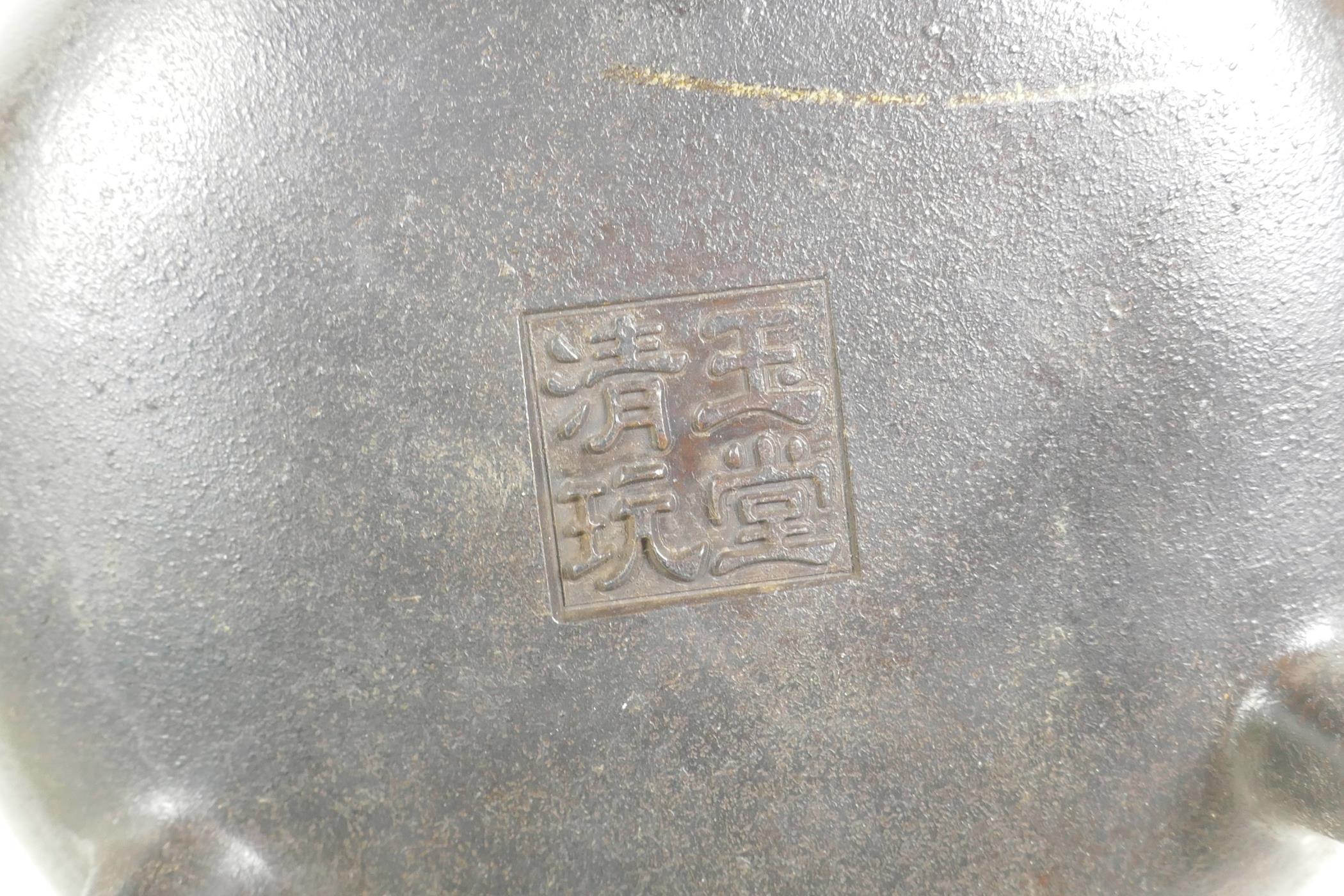 A Chinese bronze censer on tripod supports with phoenix eye handles, impressed seal mark to base, 7" - Image 3 of 3