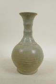 A Chinese celadon glazed pottery ring turned vase in the Song style, 10" high