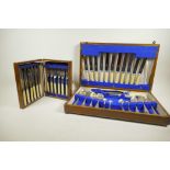 An oak cased part canteen of silver plated cutlery together with an oak cased set of fish eaters