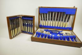 An oak cased part canteen of silver plated cutlery together with an oak cased set of fish eaters