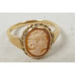 A 9ct gold ring set with shell cameo, size 'L'