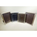 Four silver plated photograph frames, largest rebate 9" x 11" high