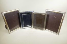 Four silver plated photograph frames, largest rebate 9" x 11" high