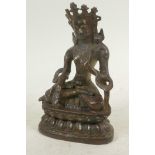 A cast bronze figure of Buddha seated in meditation on a lotus throne, 6" high