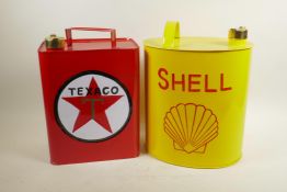 Four enamelled metal petrol cans, 12" high