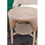 A wicker conservatory suite, comprising a two seat settee, a pair of tub chairs and an occasional