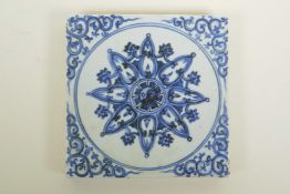 A Chinese blue and white porcelain pottery tile with Yin Yang decoration, 8" x 8"