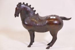 A Chinese bronze figure of a horse with saddle and harness, 15" high