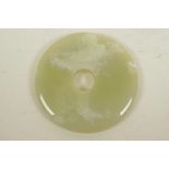 A Chinese polished hardstone pi disc, A/F, 5¼" diameter