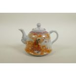 A Chinese Republic porcelain teapot decorated with a red robed Lohan, character inscription verso,