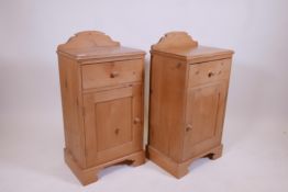 A pair of pine bedside cupboards with single drawer over cupboard raised on a shaped plinth, 16" x