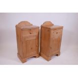 A pair of pine bedside cupboards with single drawer over cupboard raised on a shaped plinth, 16" x