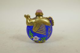 A Chinese brass snuff bottle in the form of a phoenix with enamelled highlights, 2½" high