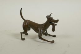 A Japanese bronzed metal figure of an enthusiastic dog, in the manner of the Disney Pixar dog