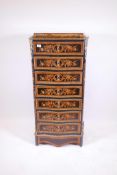 A French ormolu mounted inlaid ebony and tulipwood secretaire abbatant, with marble top and fall