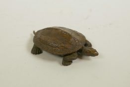 A Japanese Jizai style bronzed metal tortoise, the shell bearing character inscriptions, 3" x 2"