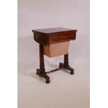 A William IV rosewood workbox, the fold over top inset with leather, the frieze drawer fitted with a