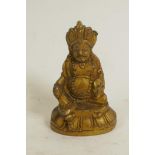 A gilt bronze figure of Buddha, 2½" high