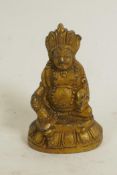 A gilt bronze figure of Buddha, 2½" high