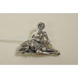 A sterling silver brooch in the form of a female nude and her dog, 1½" wide