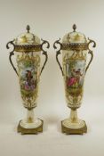 A pair of French cream ground porcelain urns and covers with gilt metal mounts and handles,