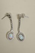 A pair of silver, cubic zirconium and opalite drop earrings, 1½" drop