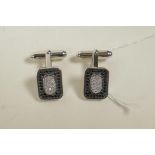 A pair of 925 silver cufflinks encrusted with cubic zirconium and marcasite