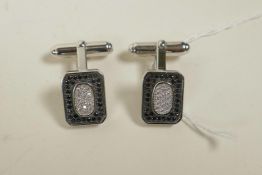 A pair of 925 silver cufflinks encrusted with cubic zirconium and marcasite