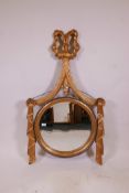 A giltwood wall mirror, with bevelled glass and swag decoration, 47" x 27"