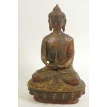 A bronze figure of Buddha seated in meditation on a lotus throne, traces of gold and red paint,