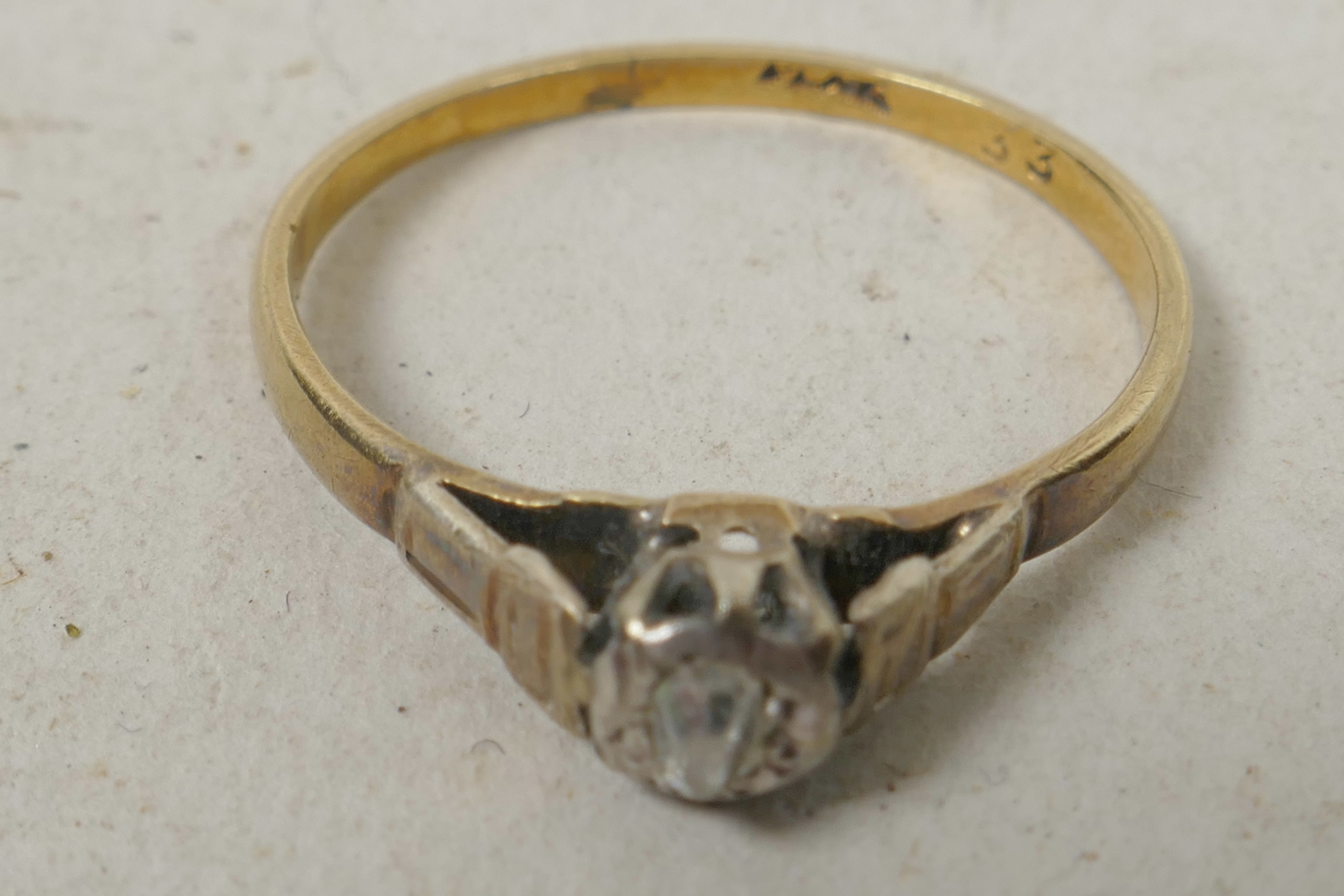 An 18ct gold and single stone old cut diamond ring, size 'L'