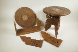 A pair of Indian carved teak low tables, inlaid with bone, 12" x 12", and an extending book slide