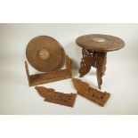 A pair of Indian carved teak low tables, inlaid with bone, 12" x 12", and an extending book slide