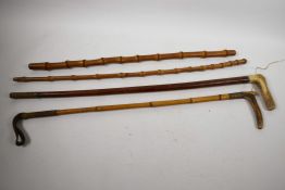 Two vintage horn handled riding crops, one with mahogany shaft, the other bamboo, longest 27",