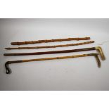 Two vintage horn handled riding crops, one with mahogany shaft, the other bamboo, longest 27",