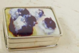 A small silver pill box with cold enamelled lid decorated with cats, 1¼" x 1"