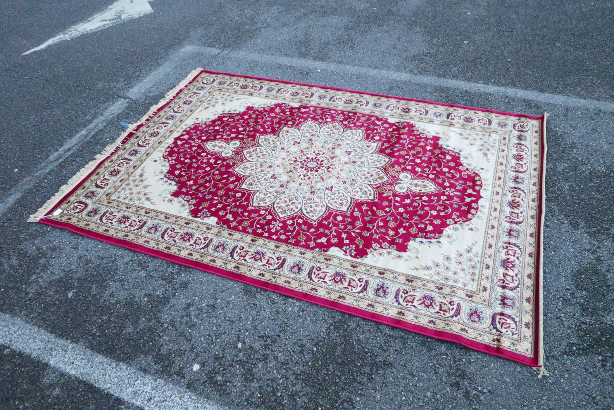 A Kashmiri red ground rug with an unique floral medallion design, 61½" x 91" - Image 2 of 5