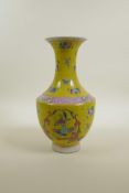 A Chinese polychrome porcelain vase decorated with objects of virtu, butterflies and kylin on a