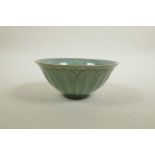 A Korean celadon glazed porcelain rice bowl with shaped lotus petal decoration, 2 character mark