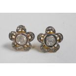 A pair of silver gilt flower shaped earrings set with Indian uncut diamonds