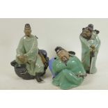 Three Chinese, Shiwan style, mud men figures in green robes, largest 8" high