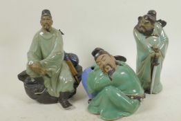 Three Chinese, Shiwan style, mud men figures in green robes, largest 8" high