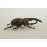 A Japanese Jizai style bronzed metal long horned insect, 2" long
