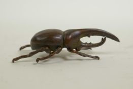 A Japanese Jizai style bronzed metal long horned insect, 2" long