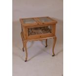 A 1920s beech rise and fall cocktail cabinet with fitted brass sections, 23" x 16", 28" high